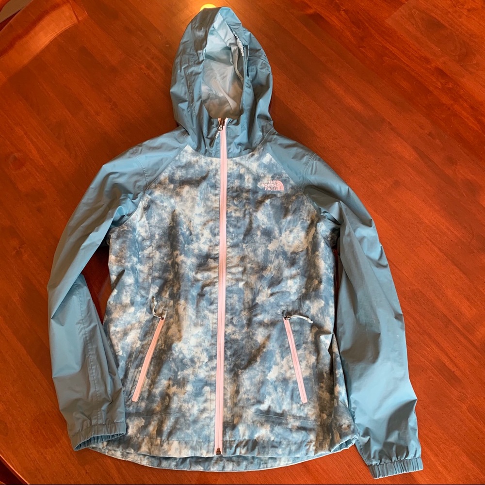 women’s blue patterned North Face rain coat